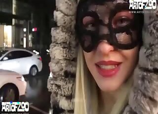 Arching her back prior to taking dog dick here